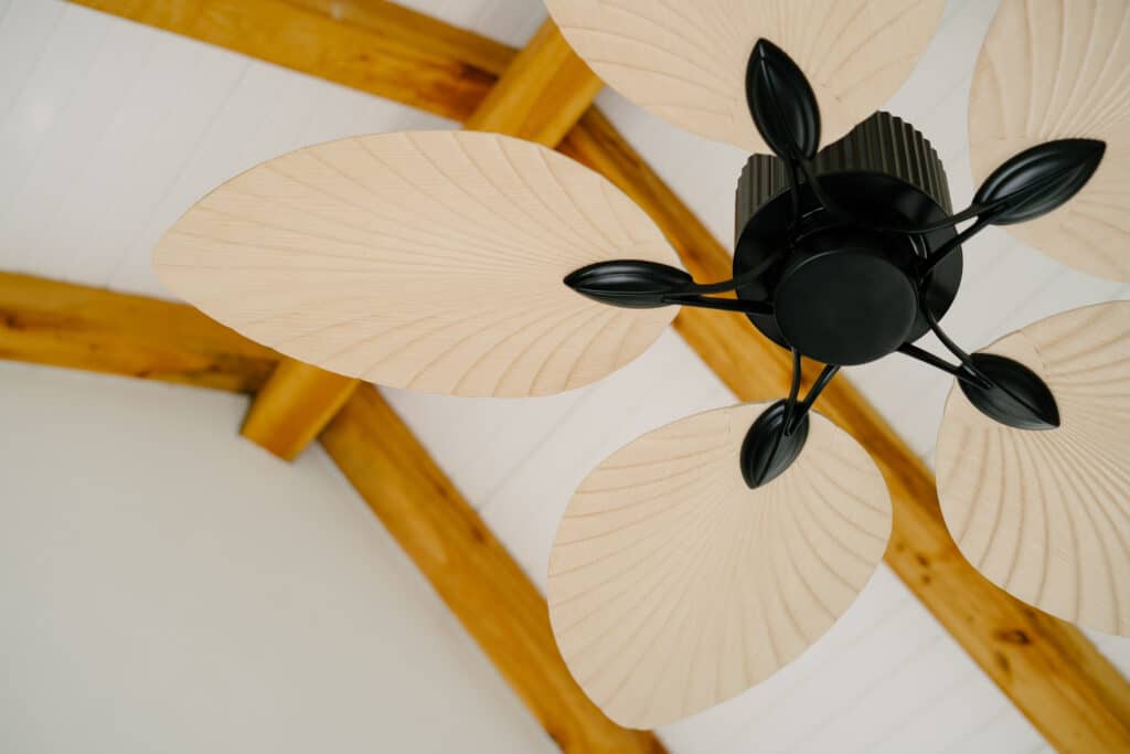 handcrafted ceiling fan featuring palm-leaf shaped blades
